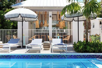 3 outdoor pools, open 7:00 AM to 10:00 PM, sun loungers at Winslows Bungalows - Key West Historic Inns