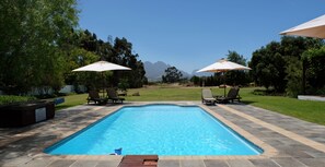 Outdoor pool, pool umbrellas, sun loungers