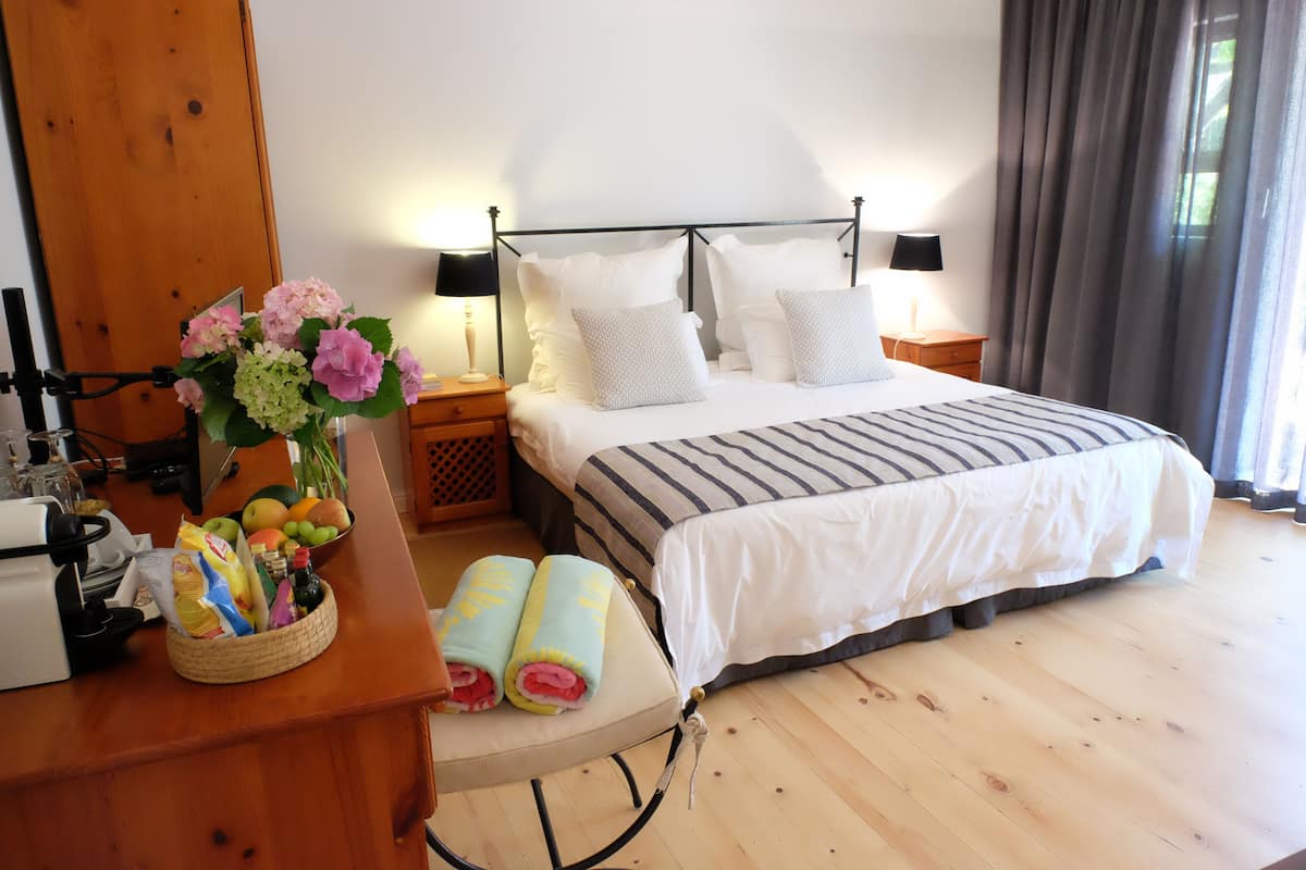 Superior Room | Minibar, in-room safe, desk, iron/ironing board