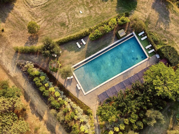Seasonal outdoor pool, pool loungers