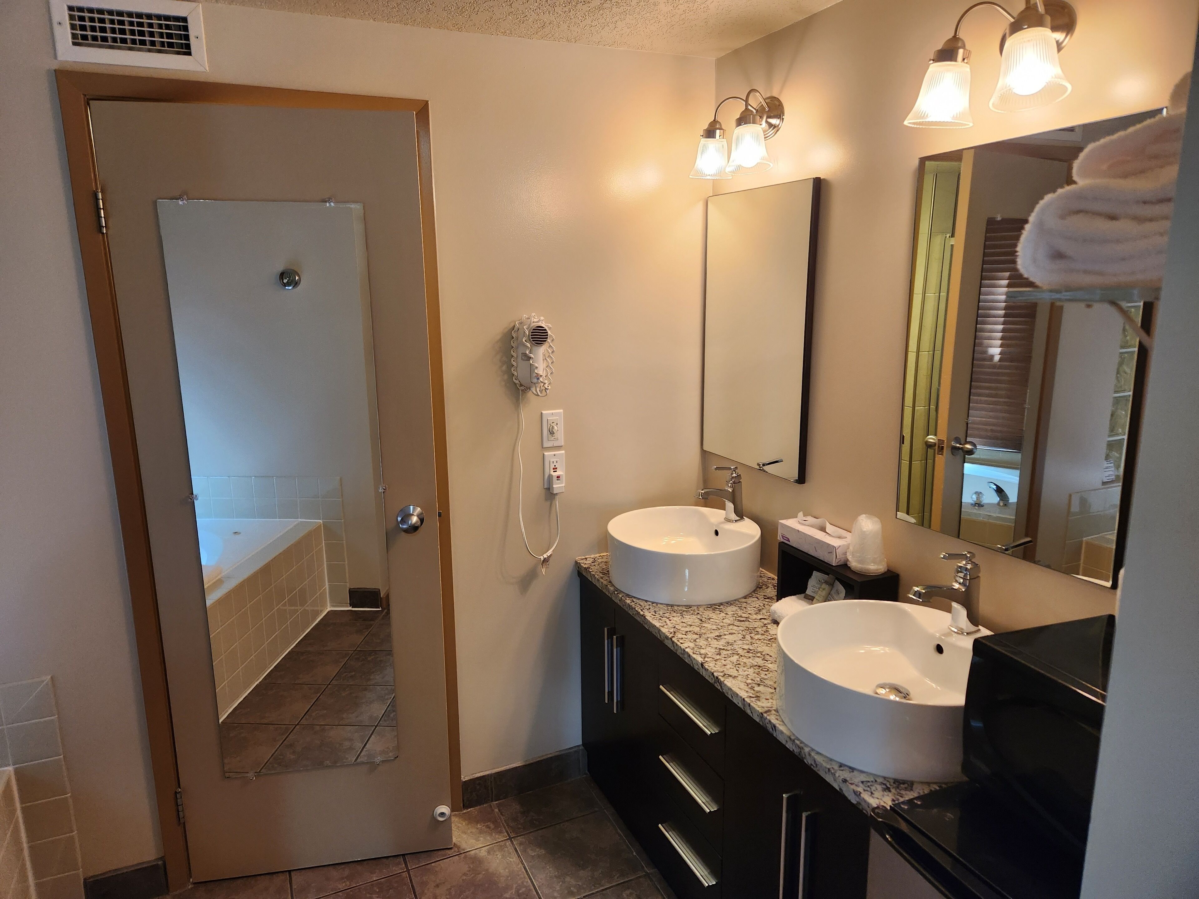 deluxe room, 1 king bed | bathroom | free toiletries, hair dryer, towels