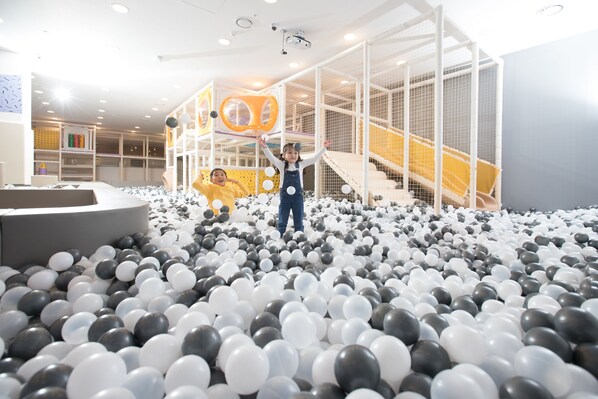 A play area with a ball pit and a climbing structure. - Lotte Hotel Jeju (Seogwipo)