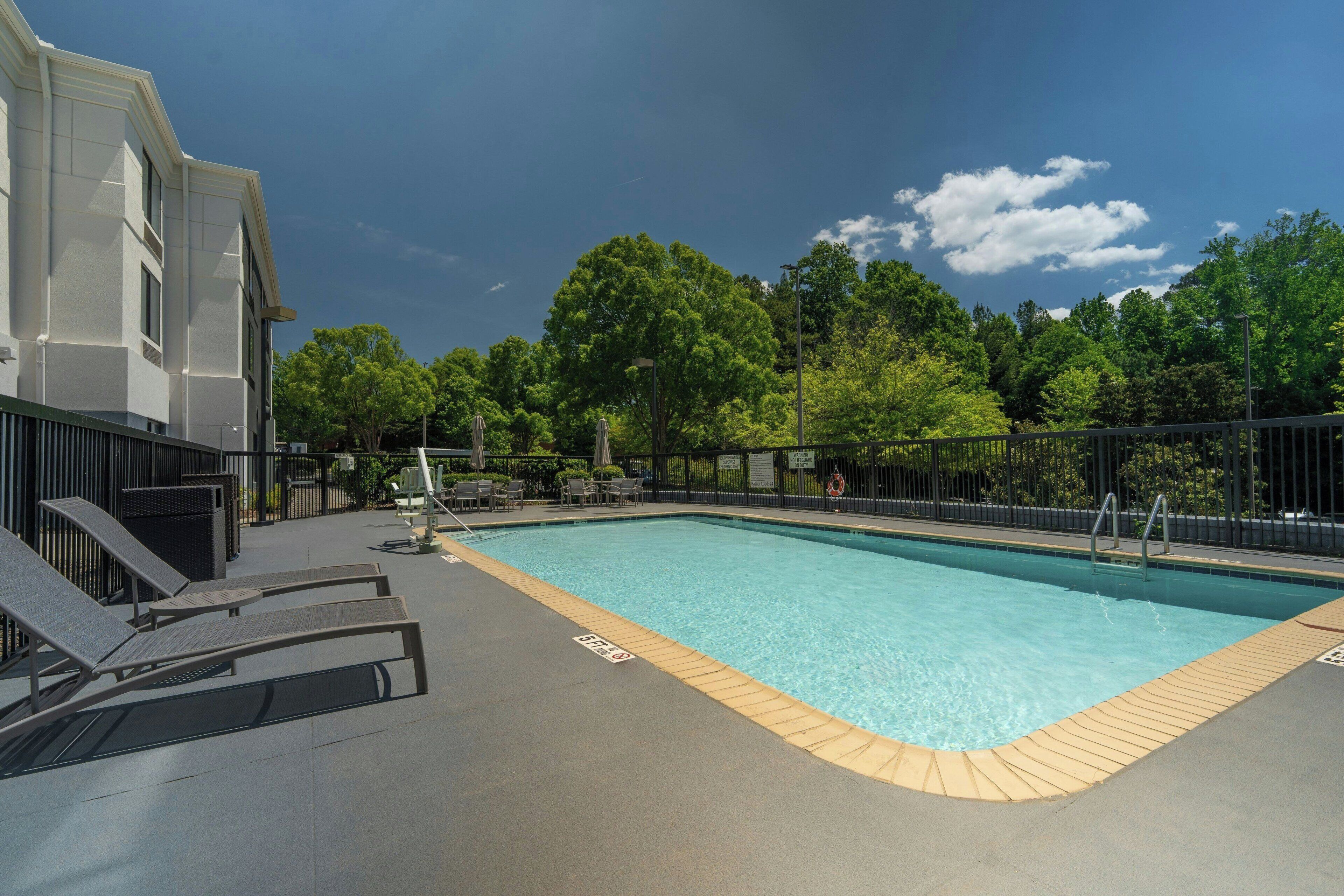 Seasonal outdoor pool, open 8:00 AM to 8:00 PM, pool umbrellas