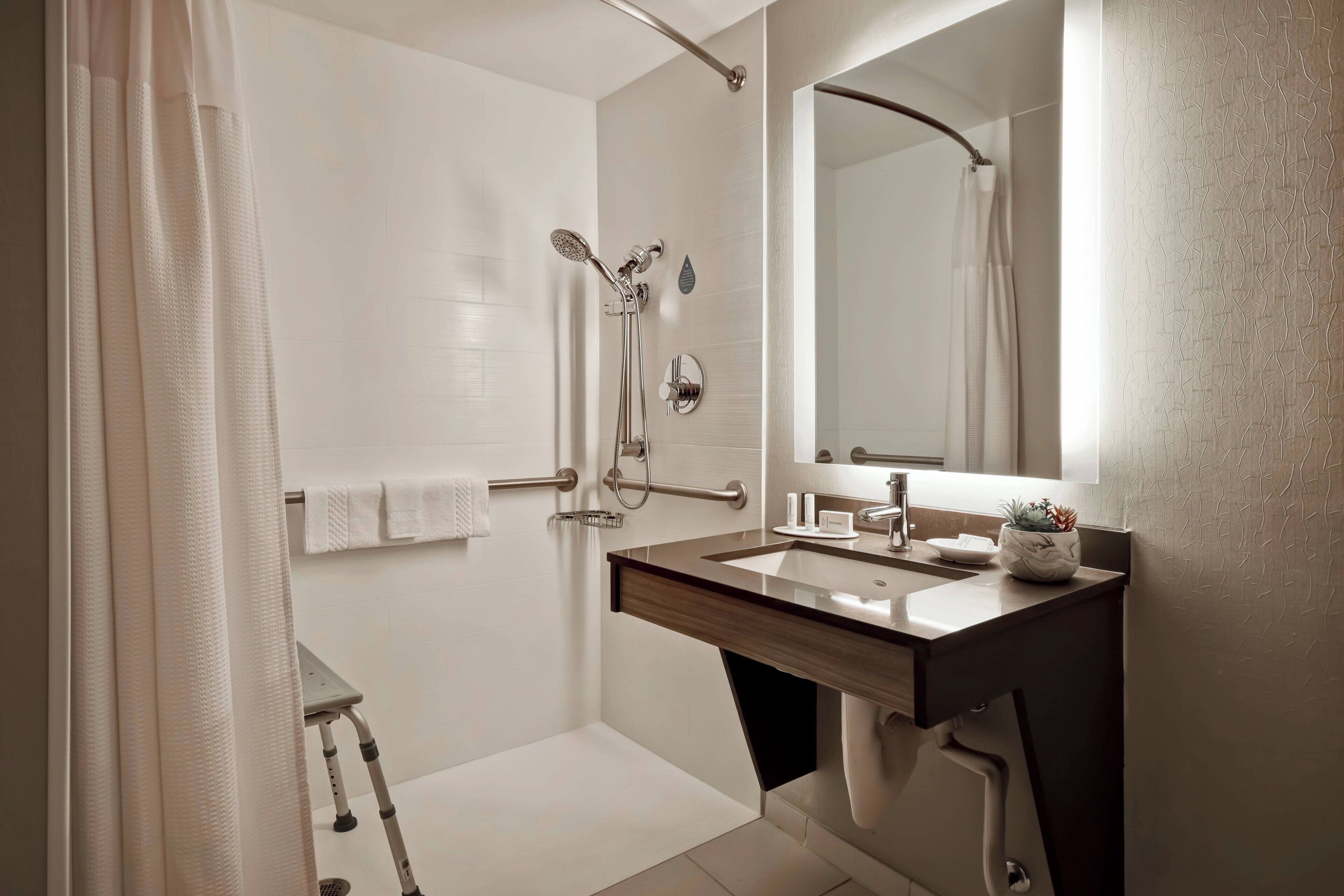 suite, 1 king bed with sofa bed, non smoking | bathroom | combined shower/bathtub, free toiletries, hair dryer, towels