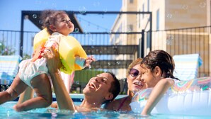 A swimming pool with inflatable floats and bubbles. - Staybridge Suites Columbia Baltimore by IHG (Columbia)