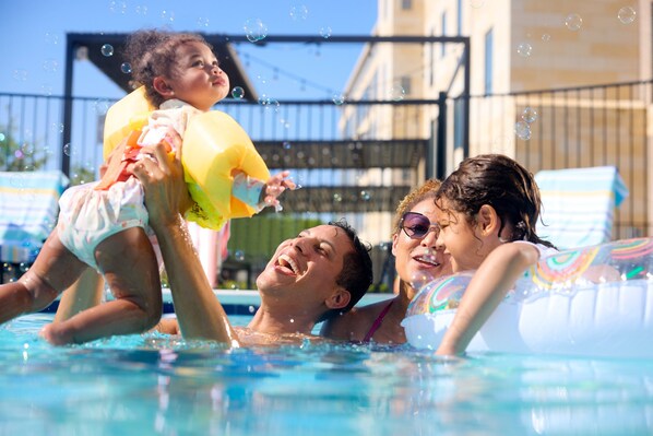 Seasonal outdoor pool, open 11:00 AM to 7:00 PM, pool umbrellas