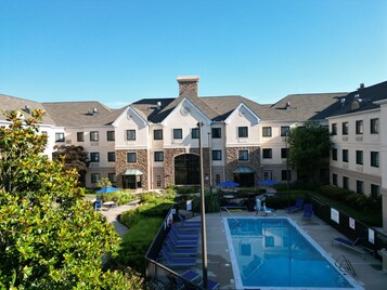 Seasonal outdoor pool, open 11:00 AM to 7:00 PM, pool umbrellas