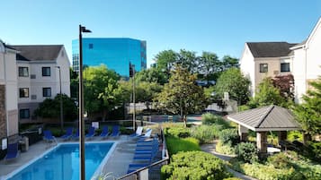 Seasonal outdoor pool, open 11:00 AM to 7:00 PM, pool umbrellas