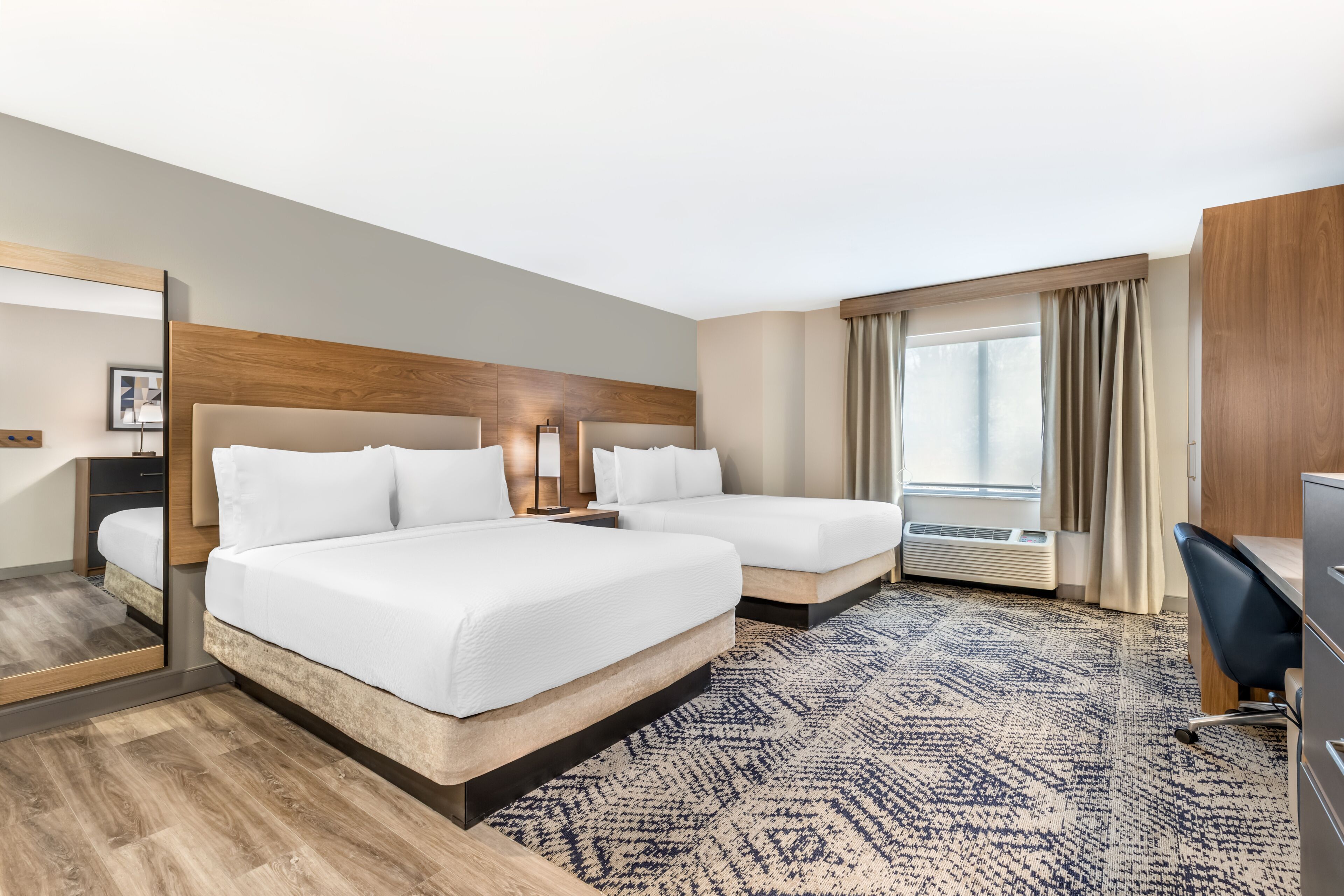 Premium bedding, desk, laptop workspace, blackout curtains