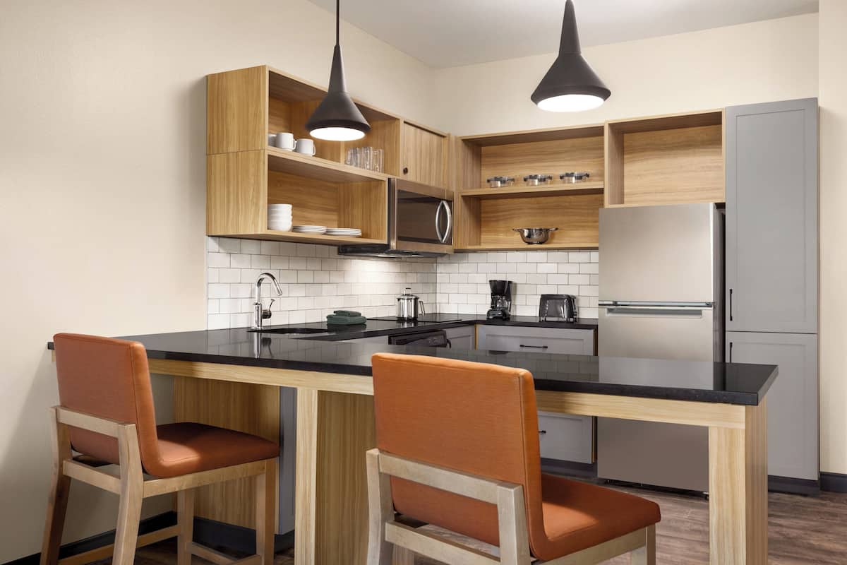 Premium bedding, desk, laptop workspace, blackout curtains