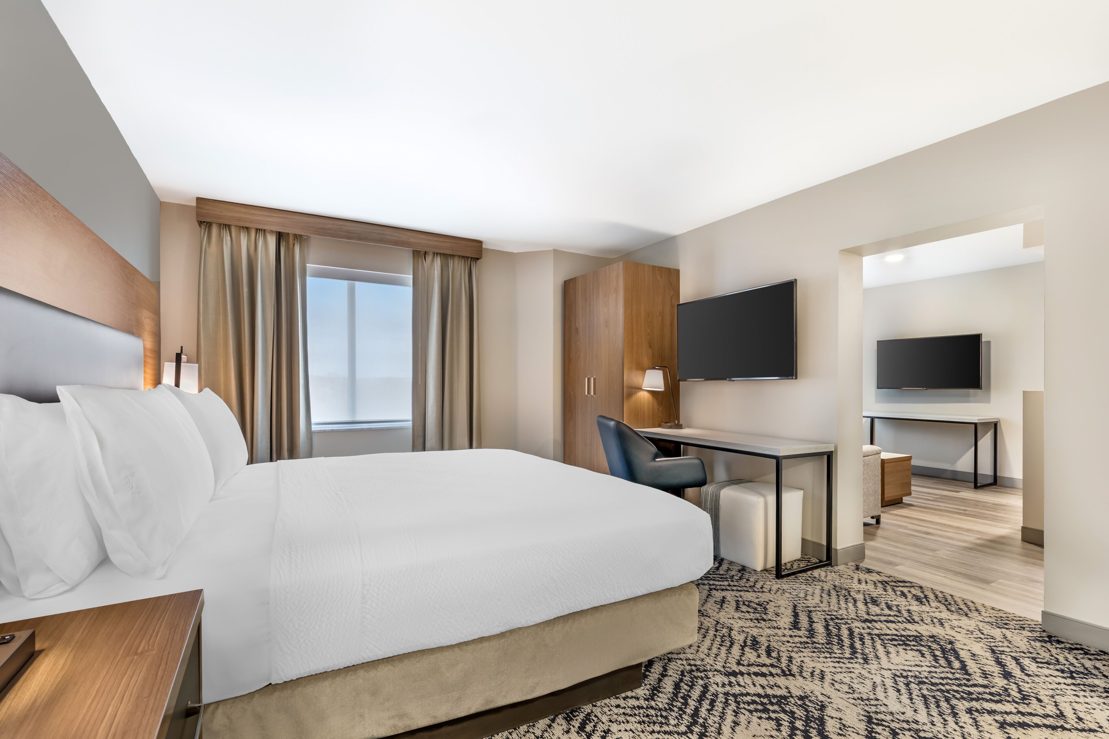 Premium bedding, desk, laptop workspace, blackout curtains