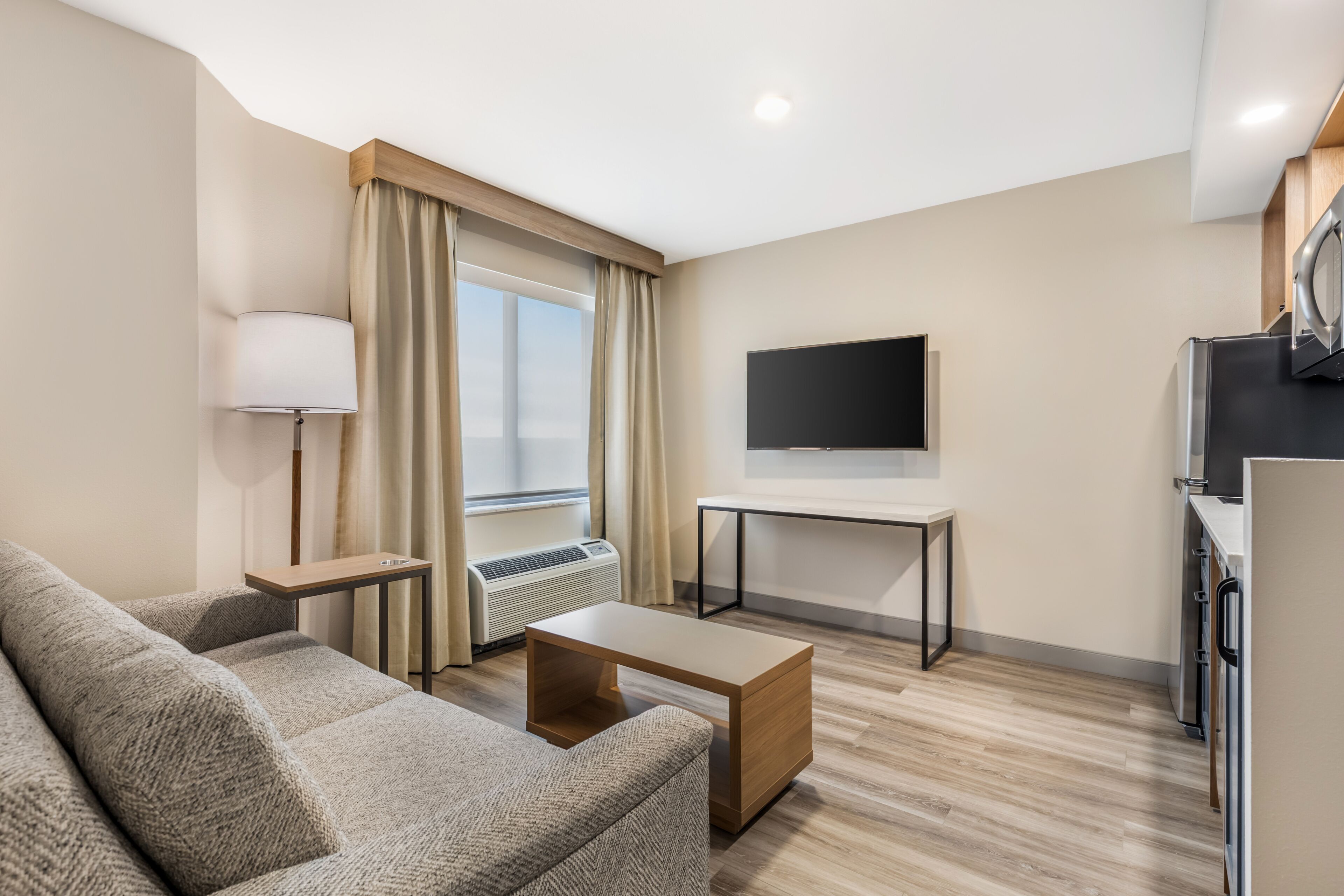 Premium bedding, desk, laptop workspace, blackout curtains