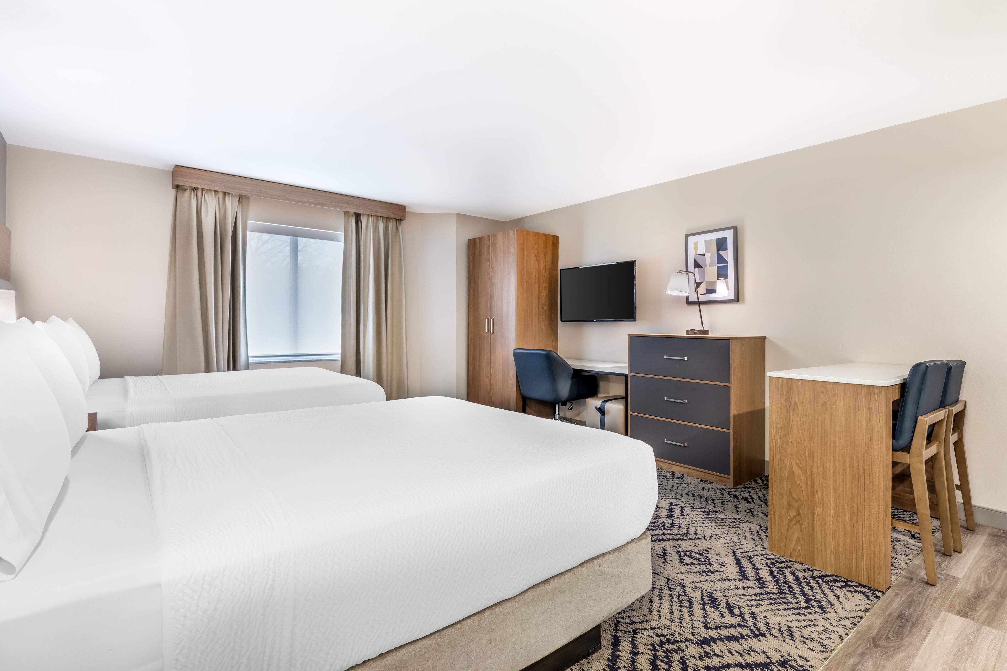 Premium bedding, desk, laptop workspace, blackout curtains