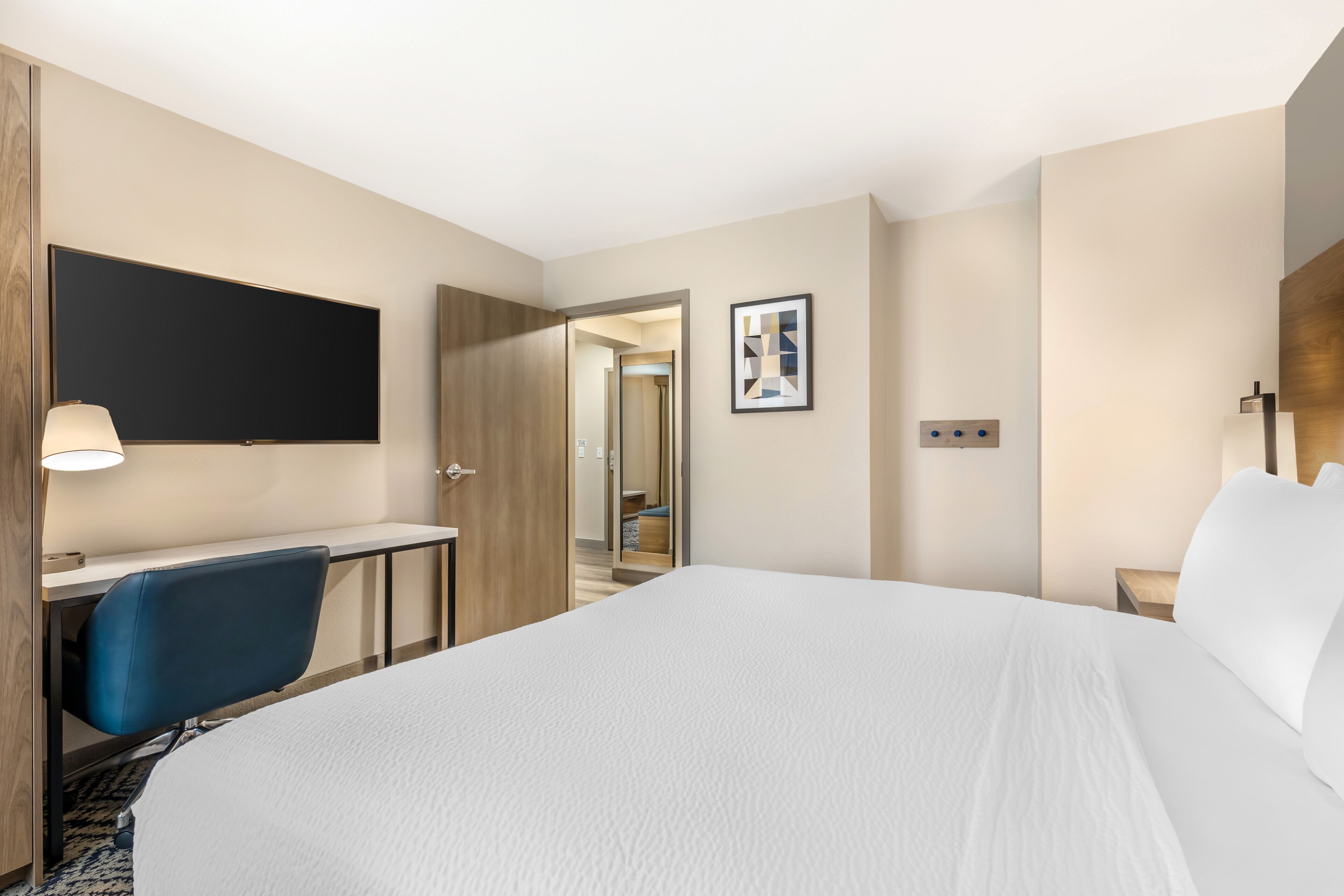 Premium bedding, desk, laptop workspace, blackout curtains