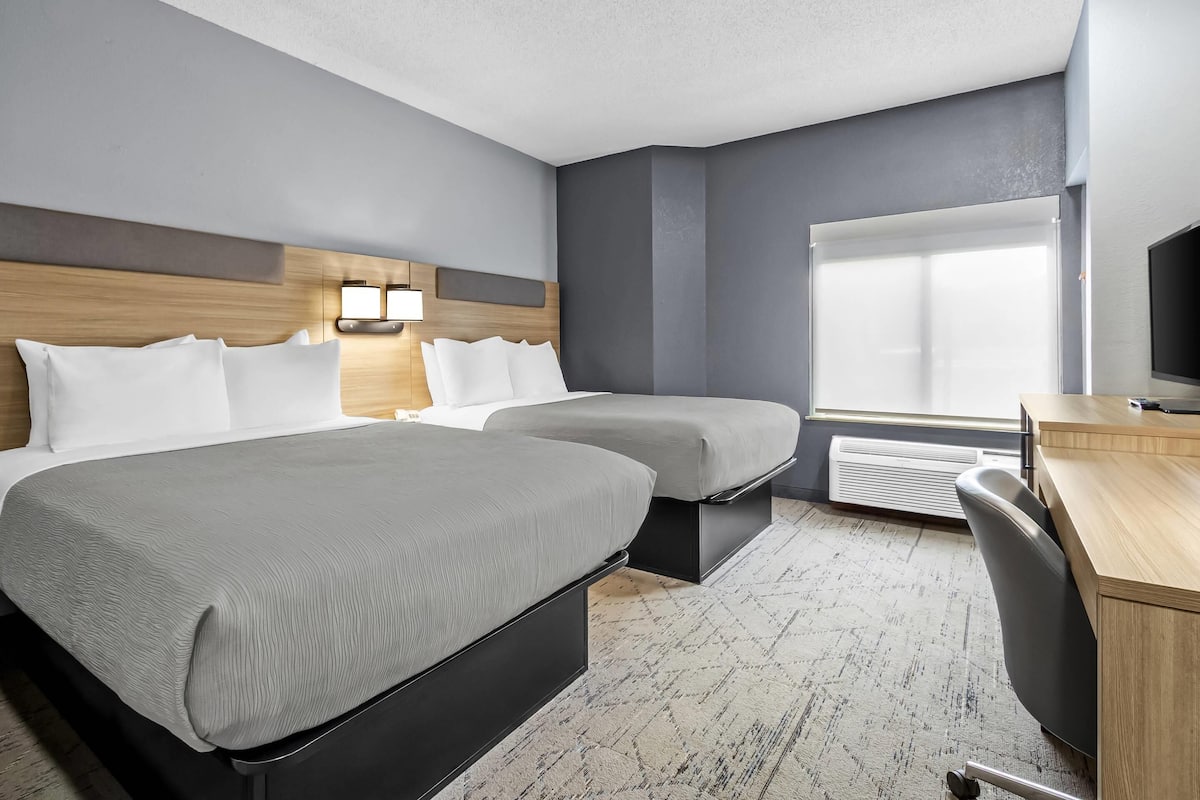 Standard Room, 2 Queen Beds, Non Smoking | Desk, blackout drapes, iron/ironing board, free cribs/infant beds