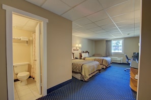 Double Room, 2 Double Beds, Non Smoking | Bathroom | Combined shower/tub, hair dryer, towels