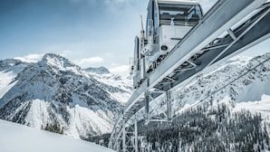 A mountain view with a ski lift structure.