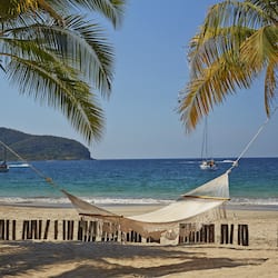 On the beach, sun loungers, beach towels