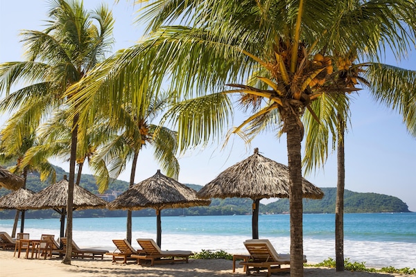 On the beach, sun loungers, beach towels