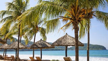 On the beach, sun-loungers, beach towels