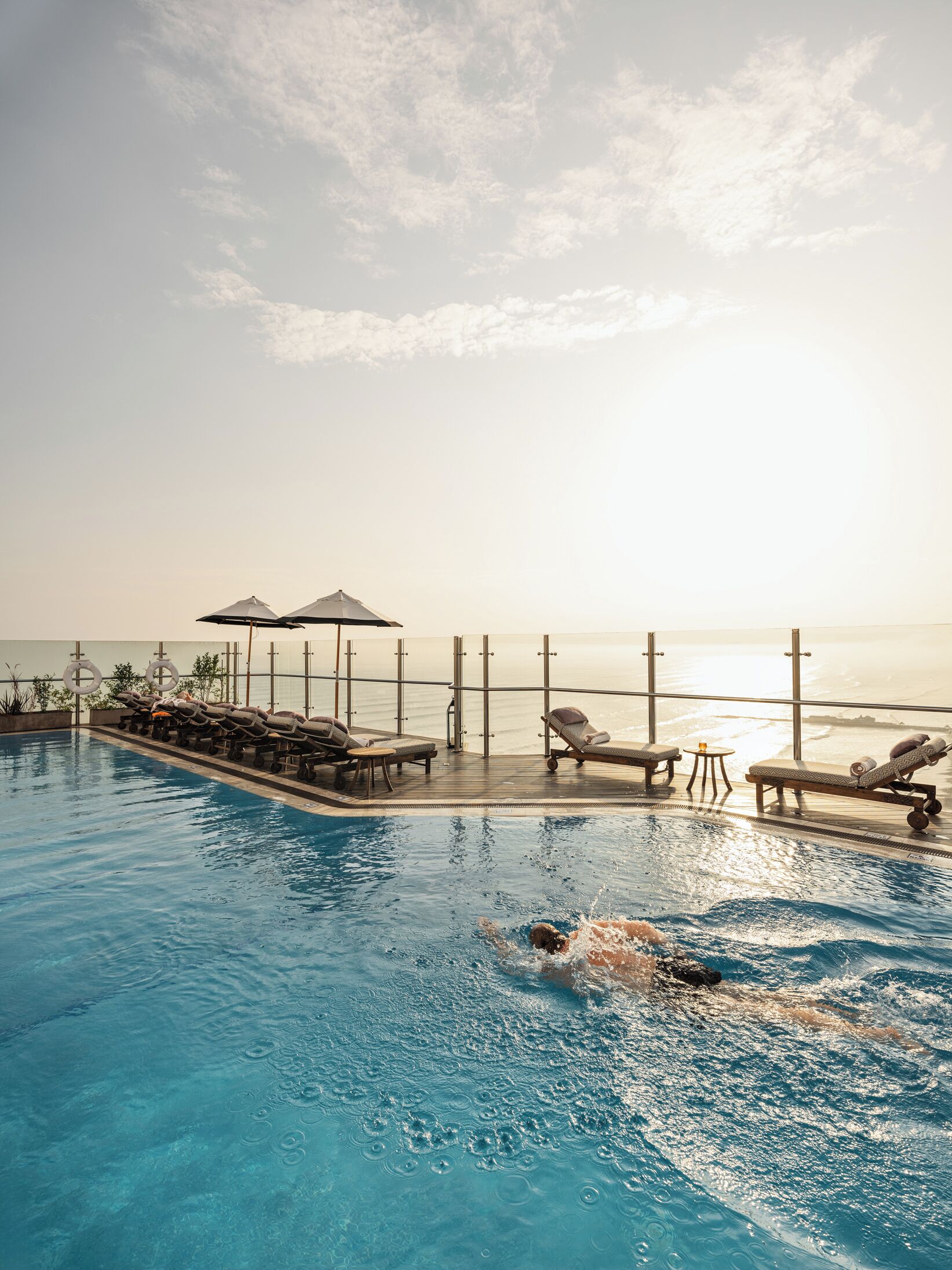 outdoor pool, open 6:00 am to 10:00 pm, pool umbrellas