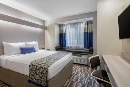 Pillowtop beds, desk, laptop workspace, blackout drapes