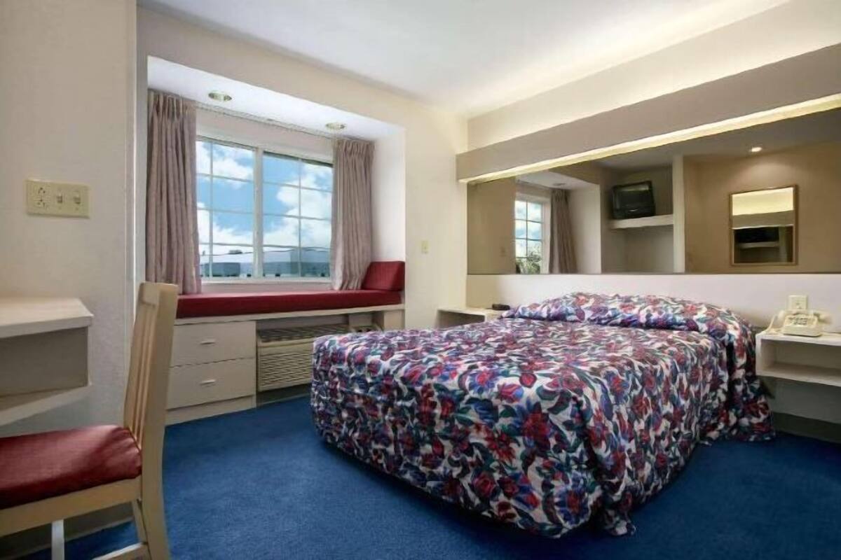 Desk, laptop workspace, blackout curtains, free WiFi