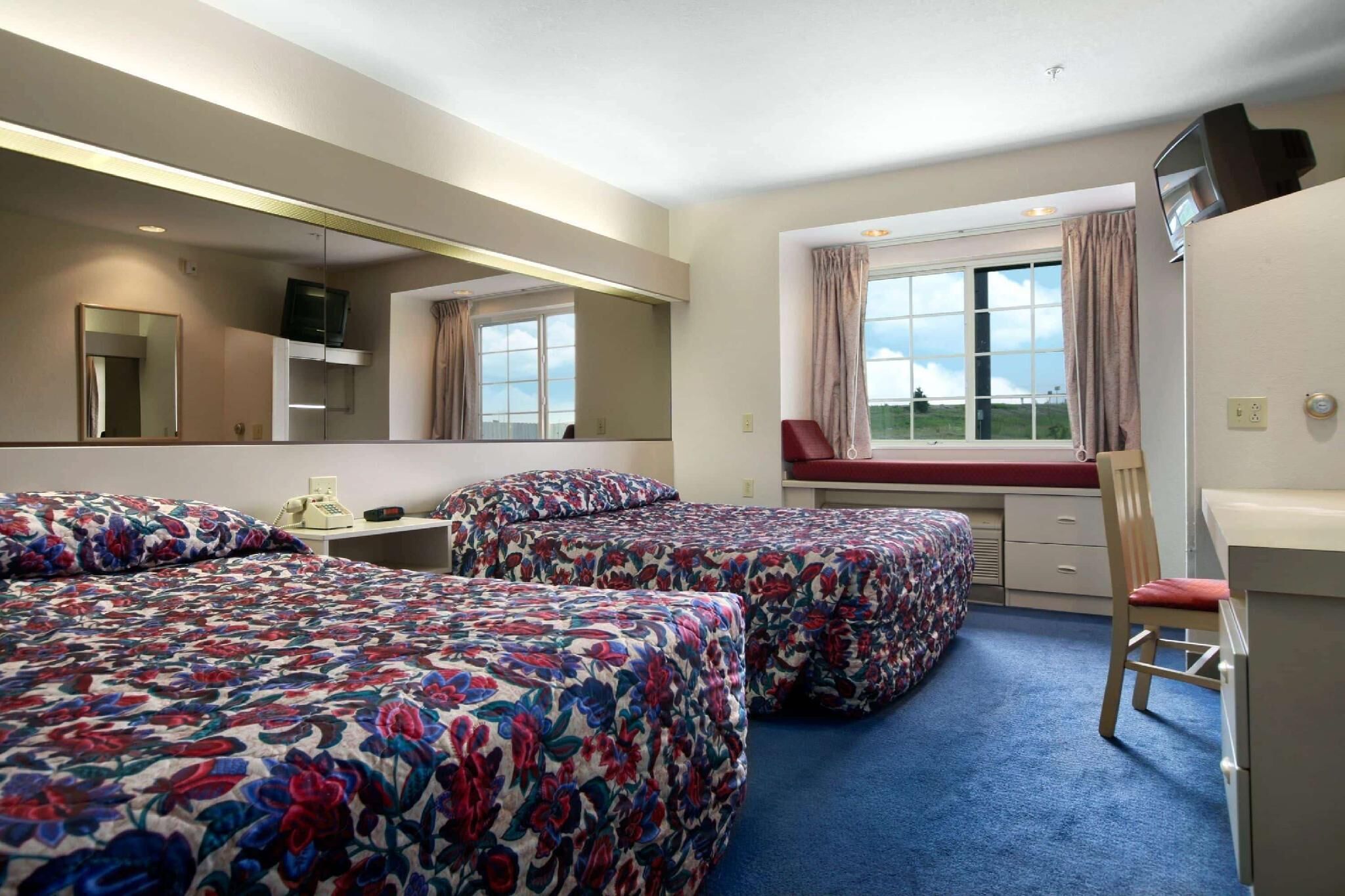 Desk, laptop workspace, blackout curtains, free WiFi
