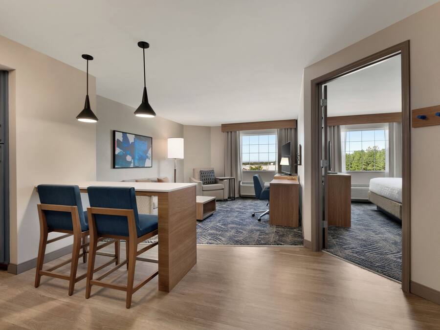 Desk, laptop workspace, blackout drapes, iron/ironing board