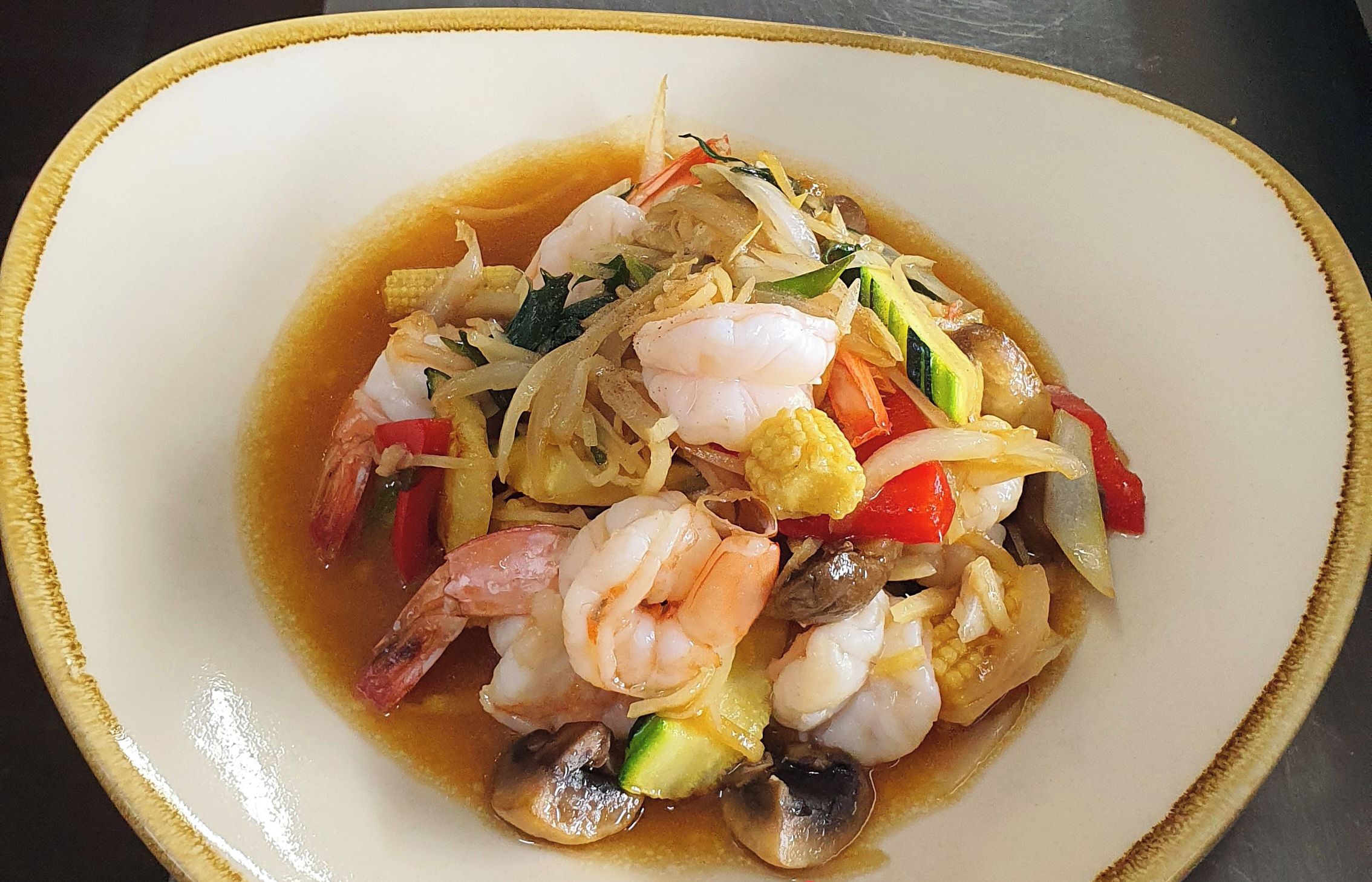 A dish of Ginger & Shallot Prawns.