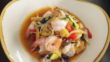 A dish of Ginger & Shallot Prawns.