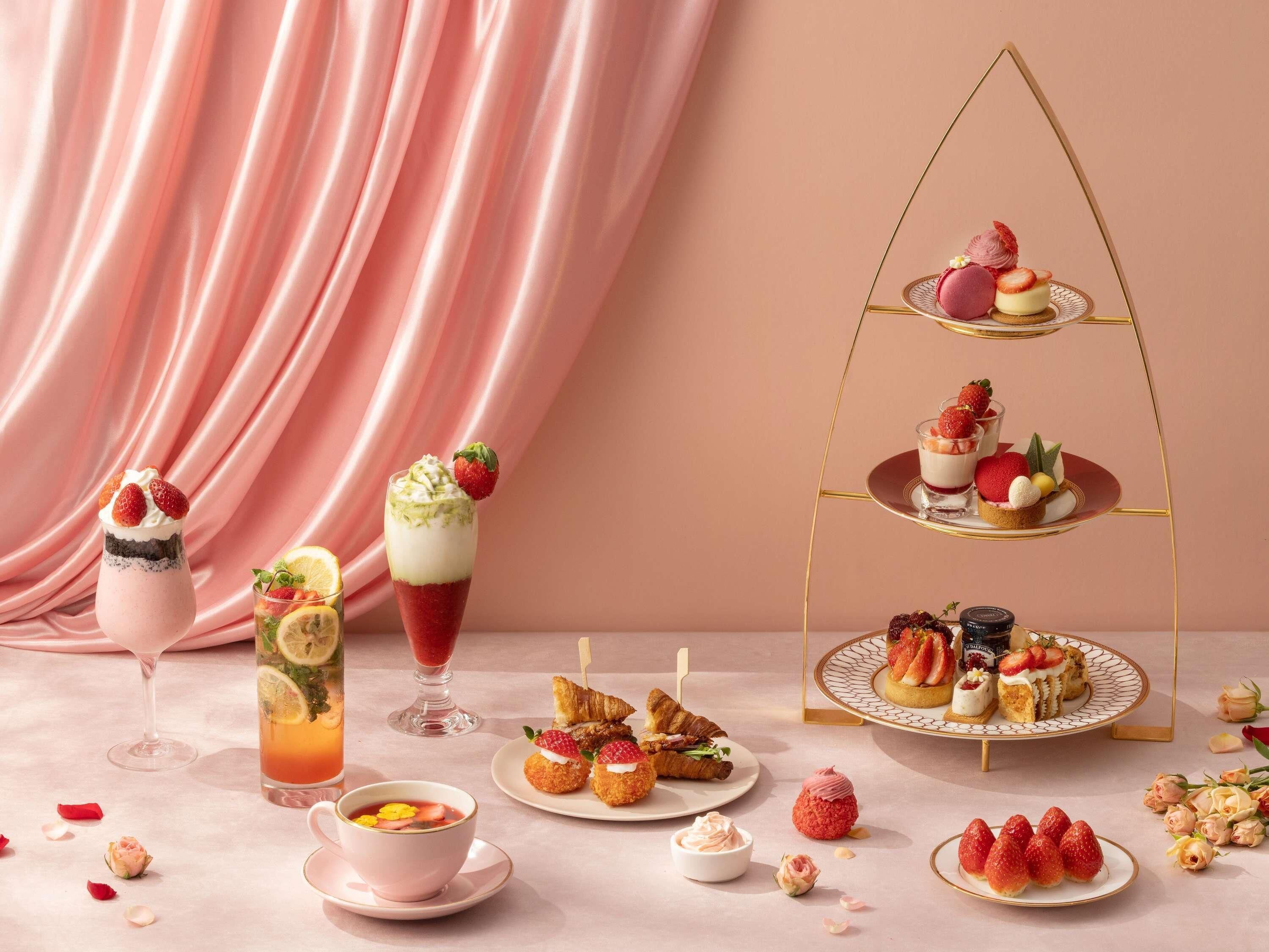 A dessert table with various sweets and drinks.
