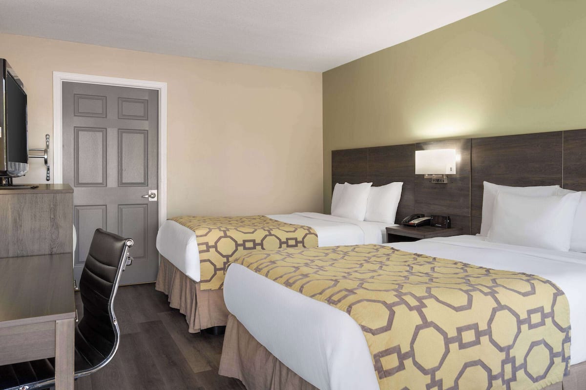 Pillow-top beds, desk, blackout curtains, iron/ironing board