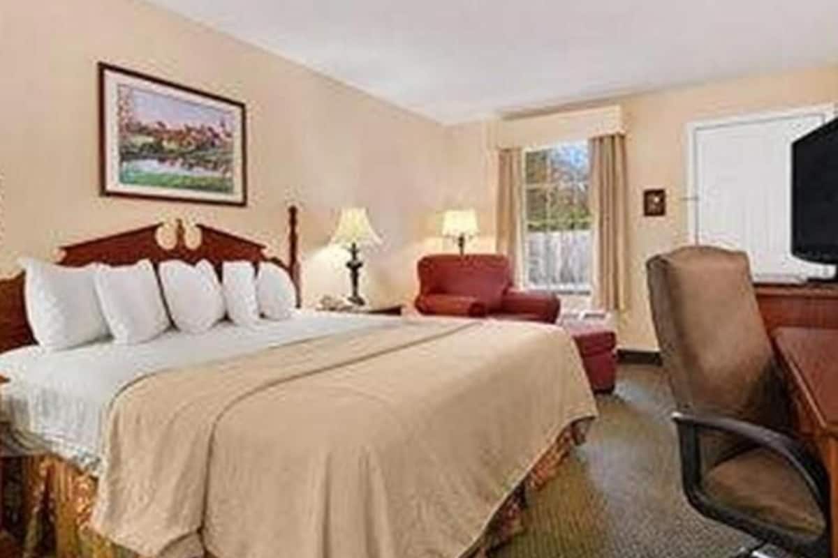 Pillowtop beds, desk, blackout drapes, iron/ironing board