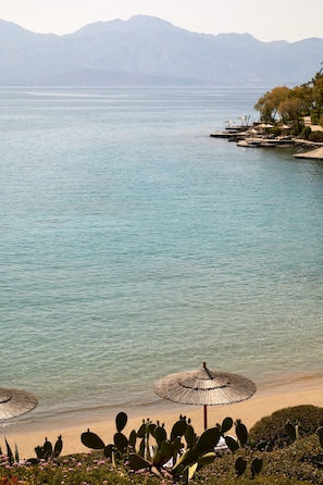 On the beach, sun-loungers, beach umbrellas, beach towels