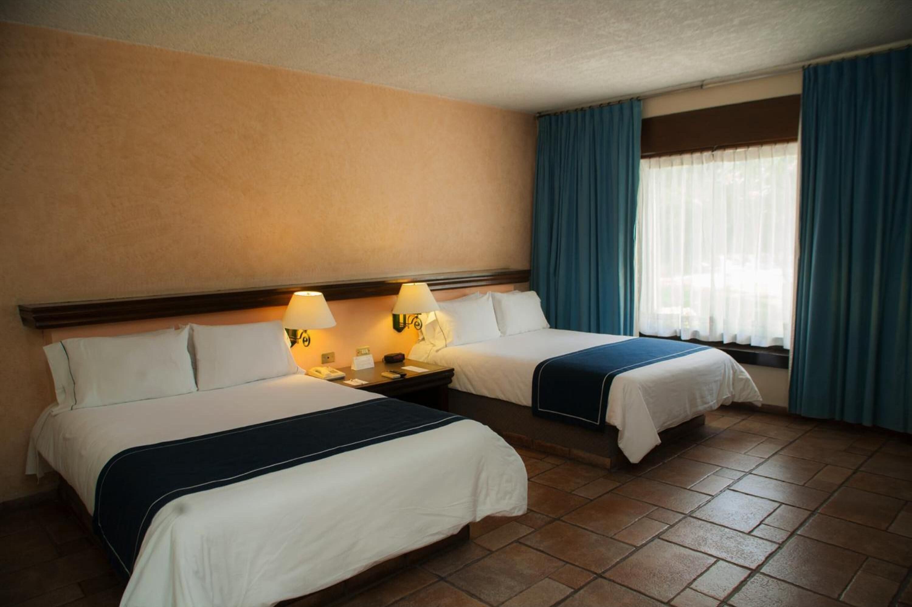 standard room, 2 double beds, pool view | premium bedding, in-room safe, individually decorated