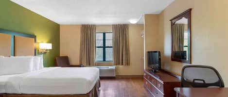 Premium bedding, desk, laptop workspace, iron/ironing board