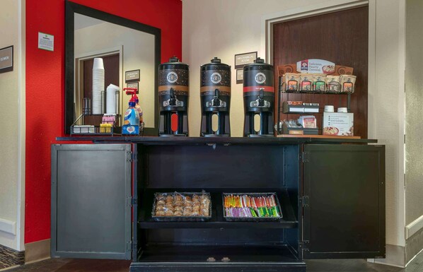 A hotel reception area with a coffee station, snack dispensers, and a refrigerated section with packaged snacks. - Extended Stay America Suites Santa Rosa North (Santa Rosa)