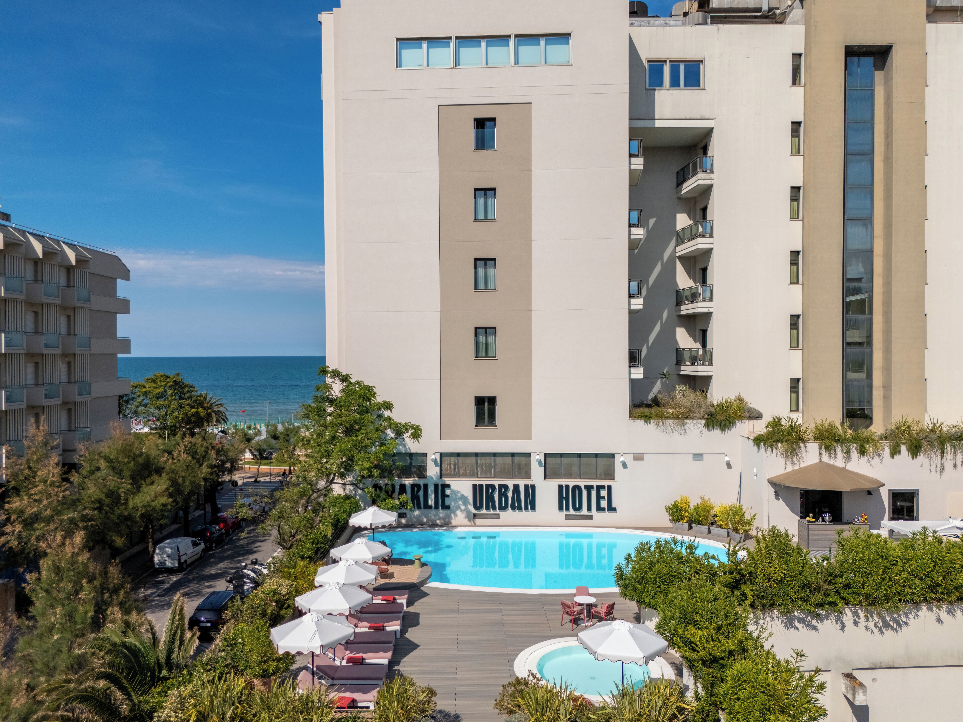 Seasonal outdoor pool, open 10:00 AM to 6:00 PM, pool umbrellas