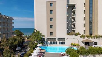 Seasonal outdoor pool, open 10:00 AM to 6:00 PM, pool umbrellas