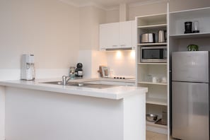 Three Bedroom Residence | Private kitchen | Full-sized fridge, microwave, stovetop, dishwasher