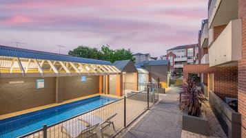 Outdoor pool, open 9:00 AM to 8:00 PM, pool loungers