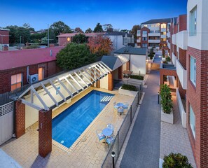 Outdoor pool, open 9:00 AM to 8:00 PM, pool loungers