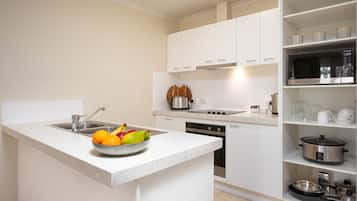 Two Bedroom Residence | Private kitchen | Full-size fridge, microwave, stovetop, dishwasher