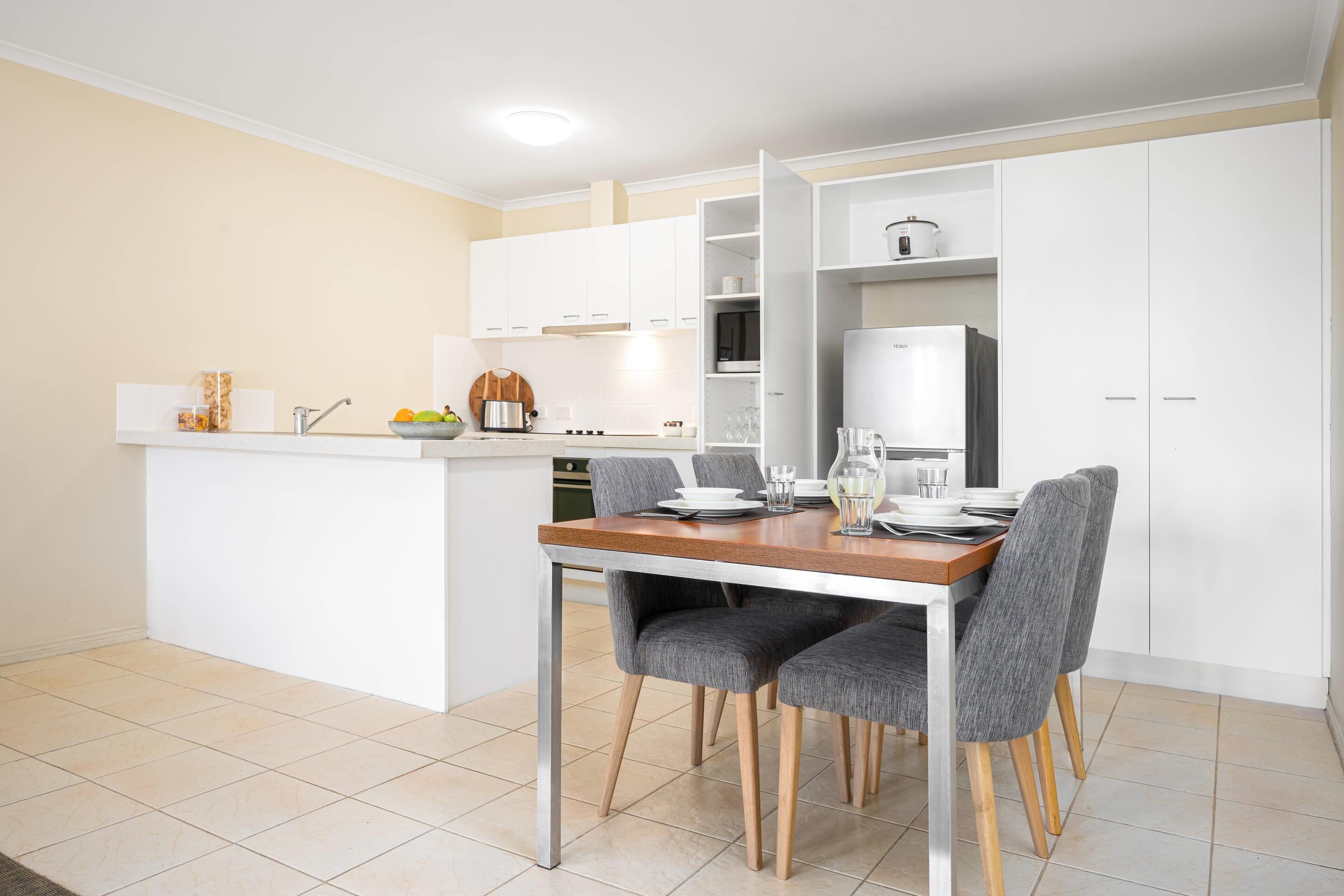 Desk, laptop workspace, blackout curtains, iron/ironing board
