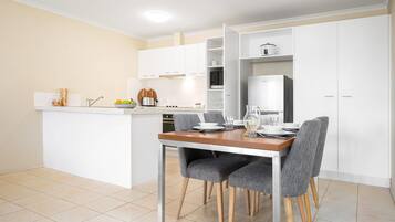 Desk, laptop workspace, blackout curtains, iron/ironing board
