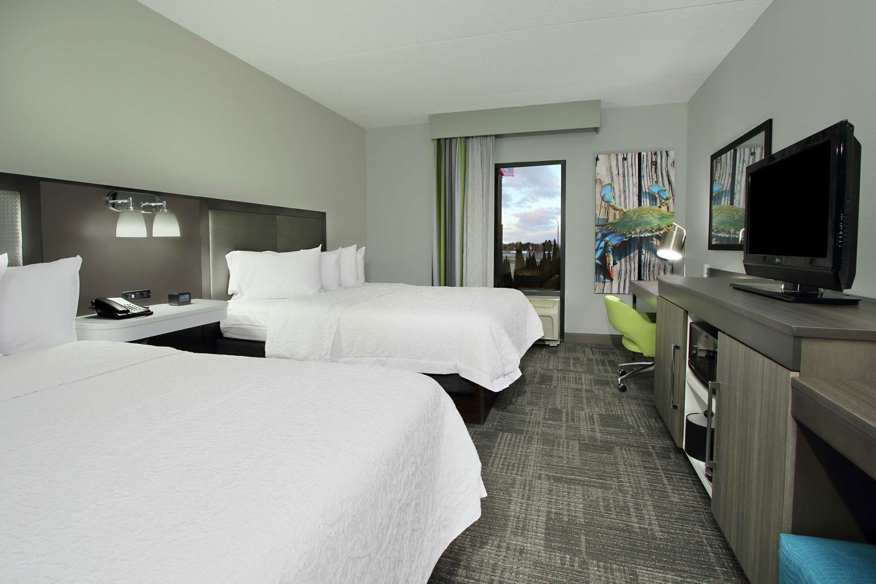 Premium bedding, desk, laptop workspace, blackout drapes