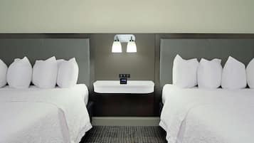 Premium bedding, desk, laptop workspace, blackout curtains