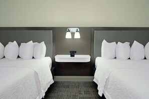Premium bedding, desk, laptop workspace, blackout drapes