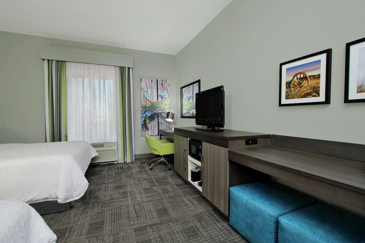 Premium bedding, desk, laptop workspace, blackout curtains